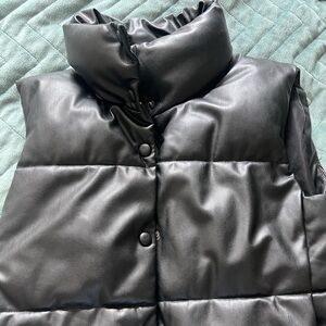 A leather sleeveless bomber jacket/vest